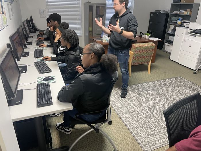 An instructor leading a lesson for FreshFoundations students in the Weaver Center computer lab.